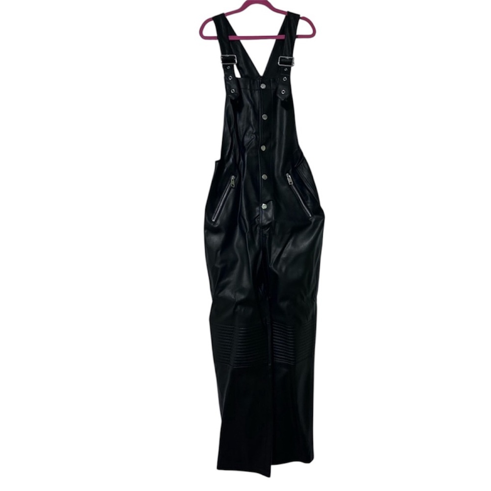 Black faux leather jumpsuit, buttoned. MANGO